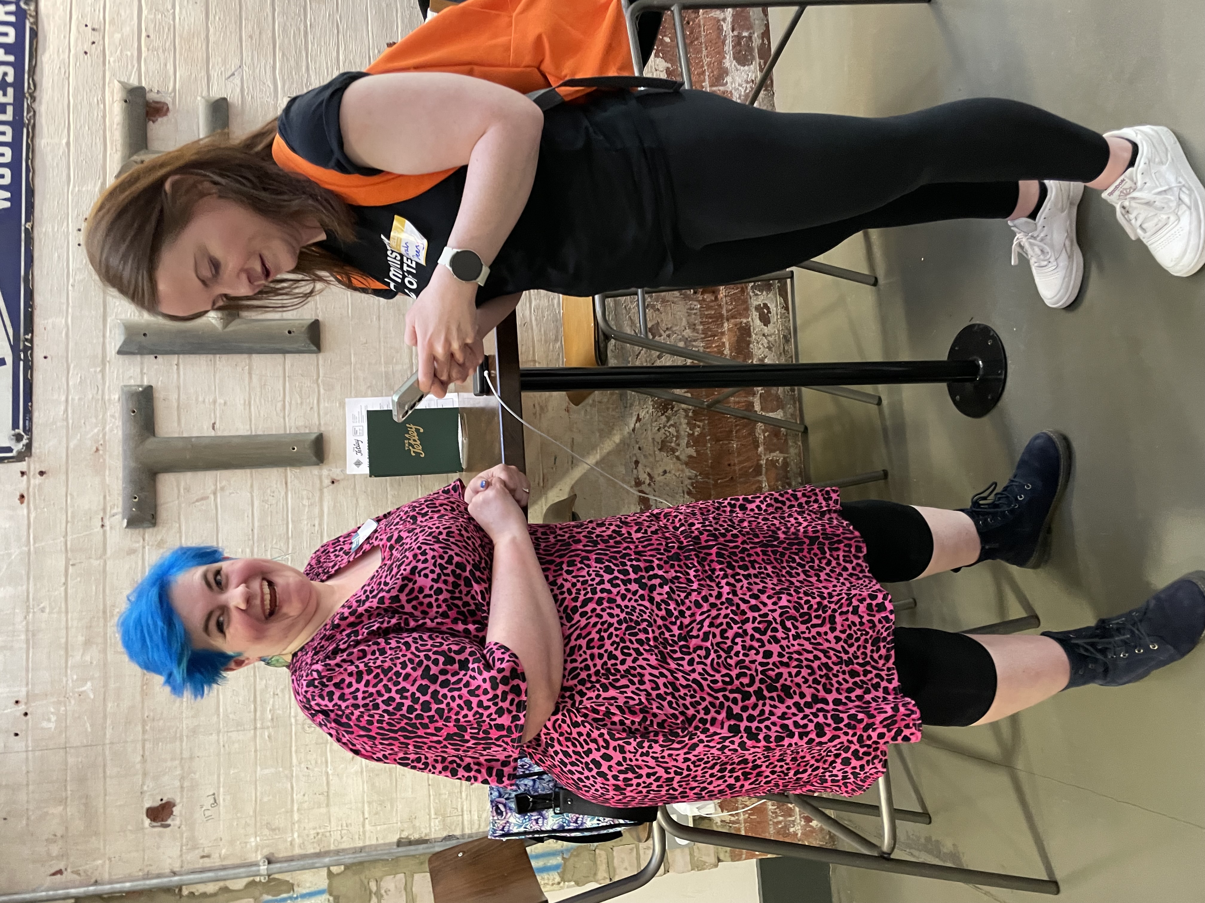 Jessica Bane is looking happy whilst Sarah Deery is taking notes of ideas on her phone.