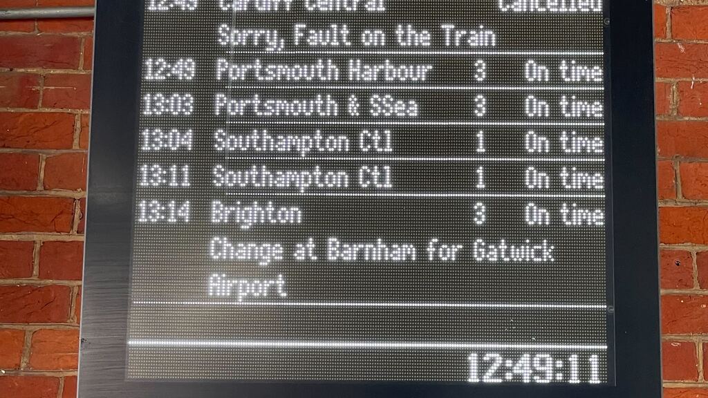 A schedule of upcoming trains, with my training showing as cancelled due to a fault.