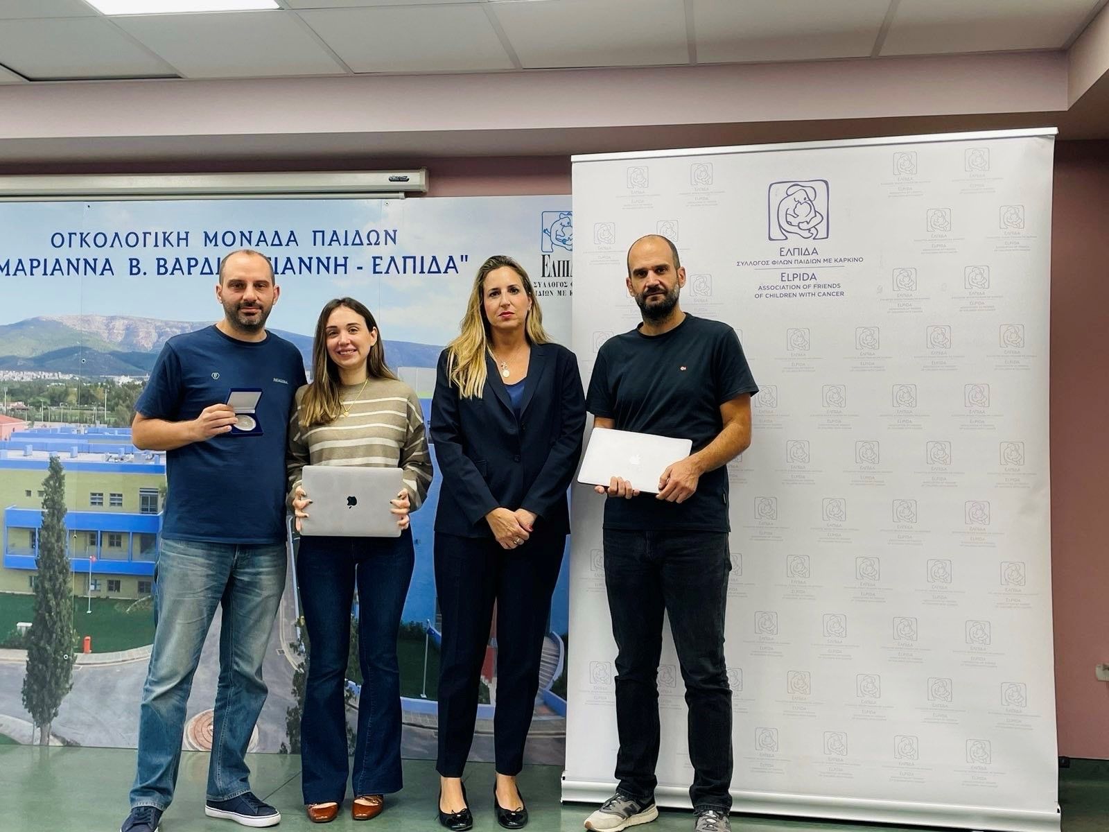 The Ministry of Testing Athens donated Apple Mac laptops to the "ELPIDA", 𝐀𝐬𝐬𝐨𝐜𝐢𝐚𝐭𝐢𝐨𝐧 𝐨𝐟 𝐅𝐫𝐢𝐞𝐧𝐝𝐬 𝐨𝐟 𝐂𝐡𝐢𝐥𝐝𝐫𝐞𝐧 𝐰𝐢𝐭𝐡 𝐂𝐚𝐧𝐜𝐞𝐫. These laptops will be used by both the staff and the children—a small gesture, but the kids were thrilled to receive them.