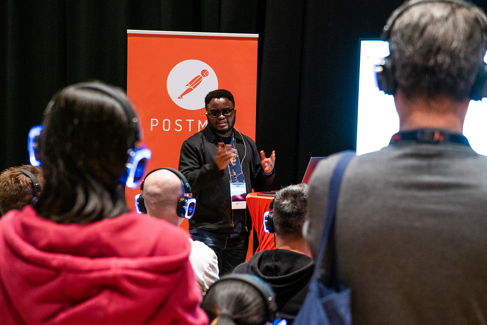 Gbadebo Bello representing Postman at MoTaCon25.