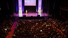 Demi Van Malcot is on stage here at MoTaCon 2025. image