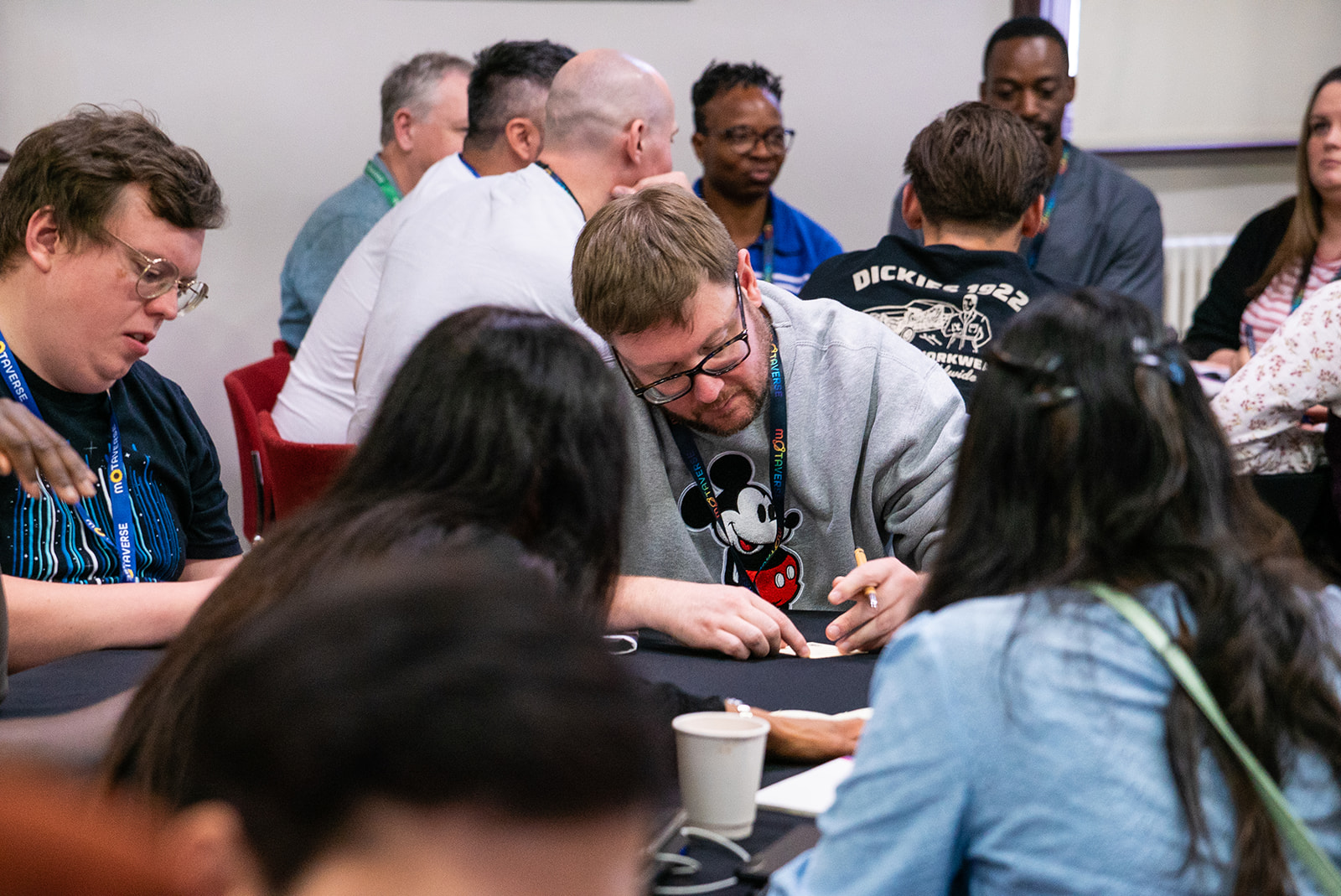 Quality people thinking hard around a table at a workshop