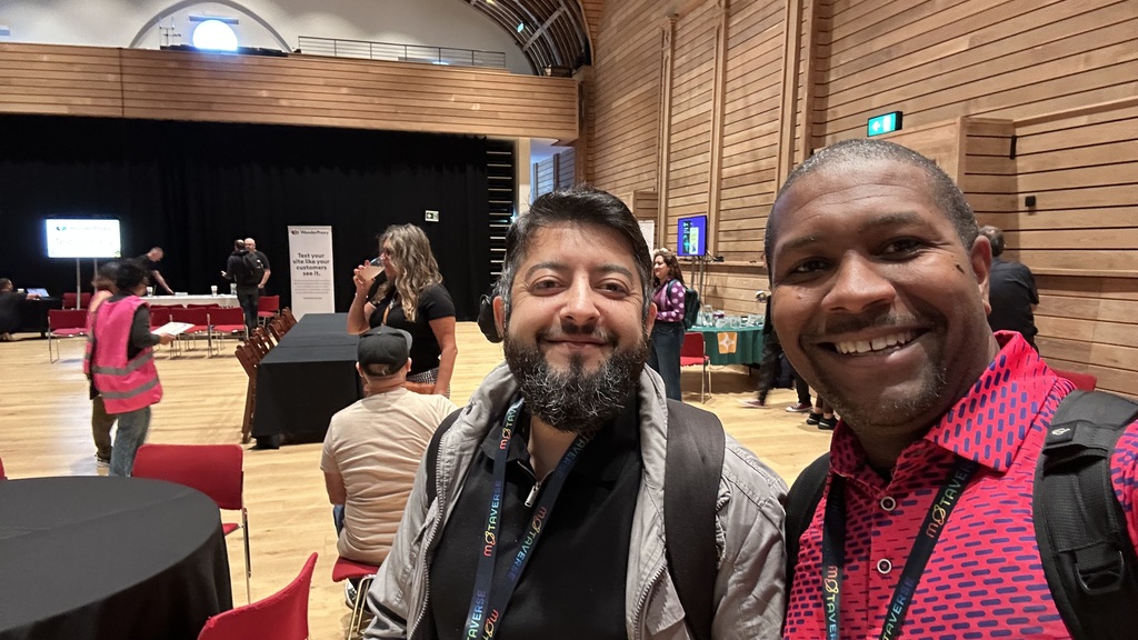 Two guys standing in the corn exchange.  image
