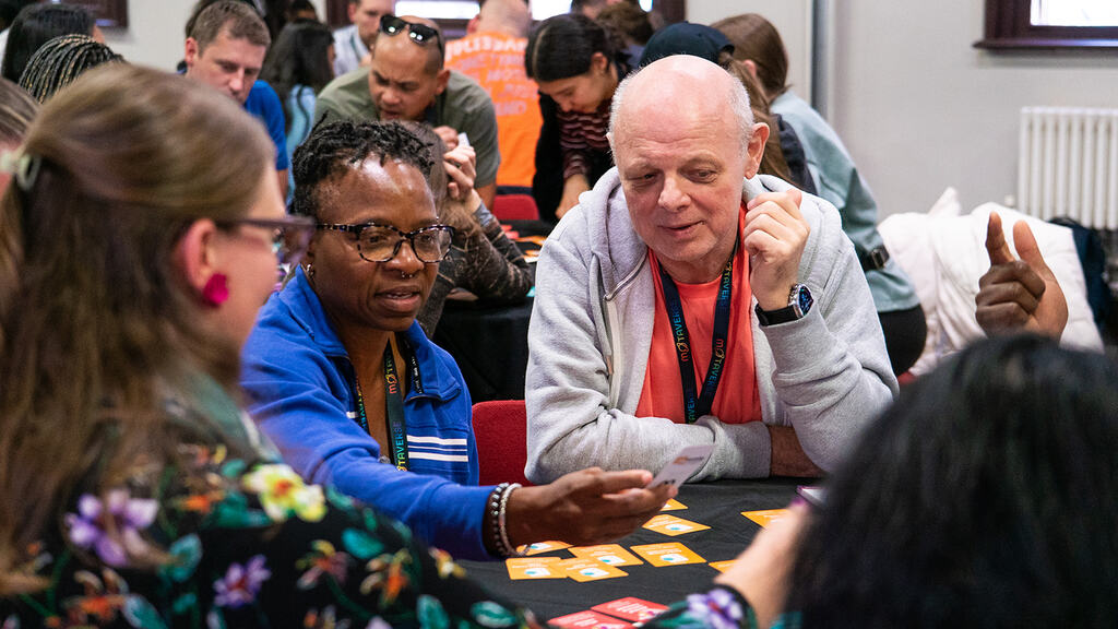 People gathered around a RiskStorming and AI session.