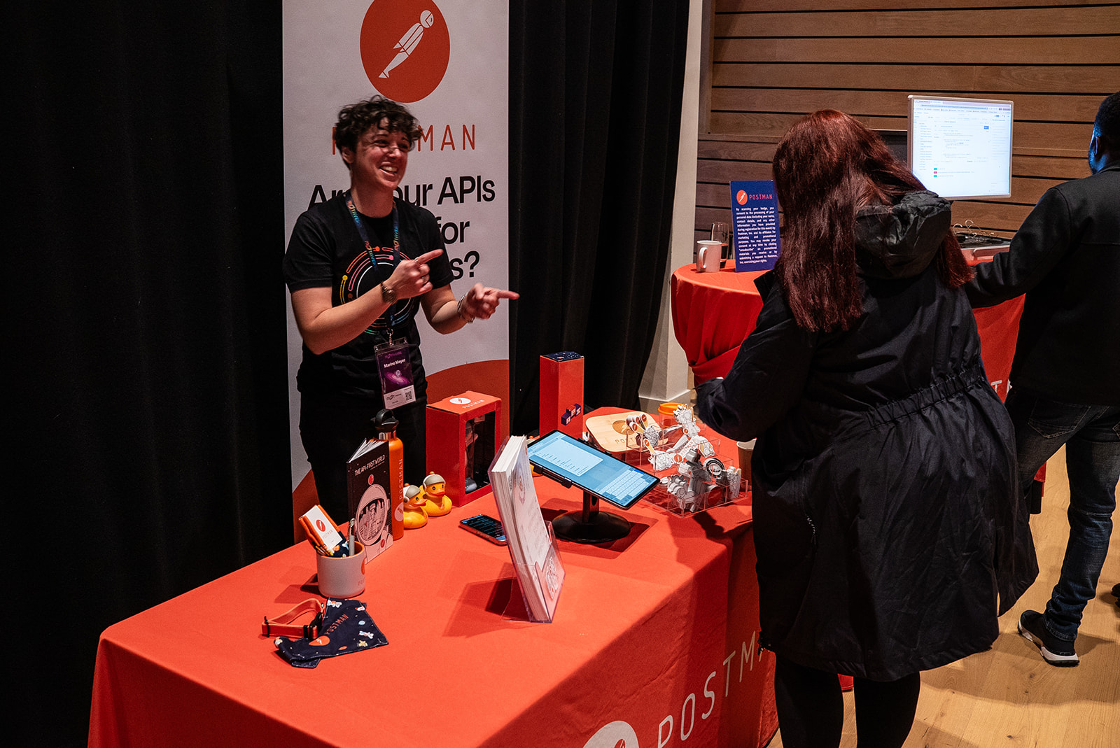 Happy action shot of Marine Meyer of Postman at the MoTaCon25 sponsor stand.