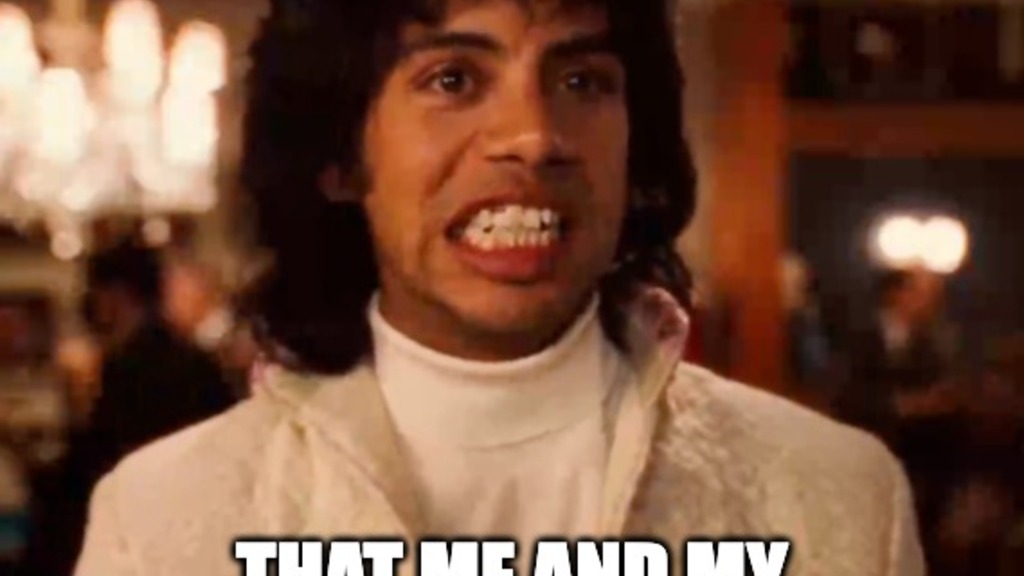 Alt text: A meme featuring a man with curly dark hair wearing a white turtleneck and jacket, making an exaggerated cl... image