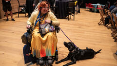 Krys and her guide dog, Luna, at MoTaCon 2025. image