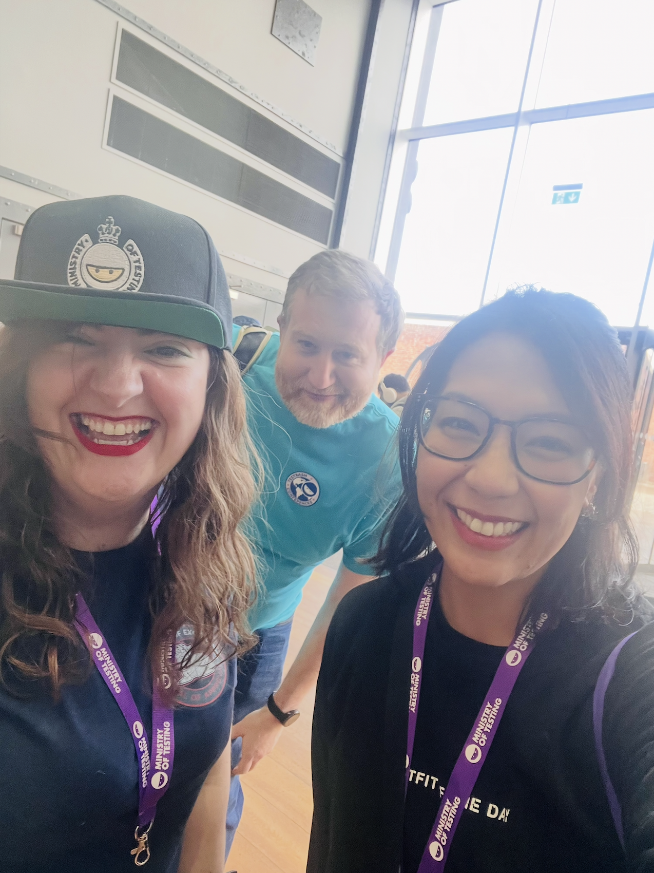 Three people smiling for a selfie at TestBash Liverpool 2023