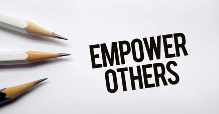 The image is showing 3 pencils on while background. Empower othesr caption is on the image.