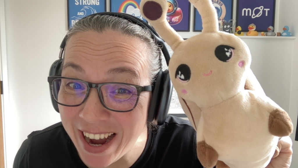 A selfie of Rosie Sherry and a soft cuddlly toy snail. image