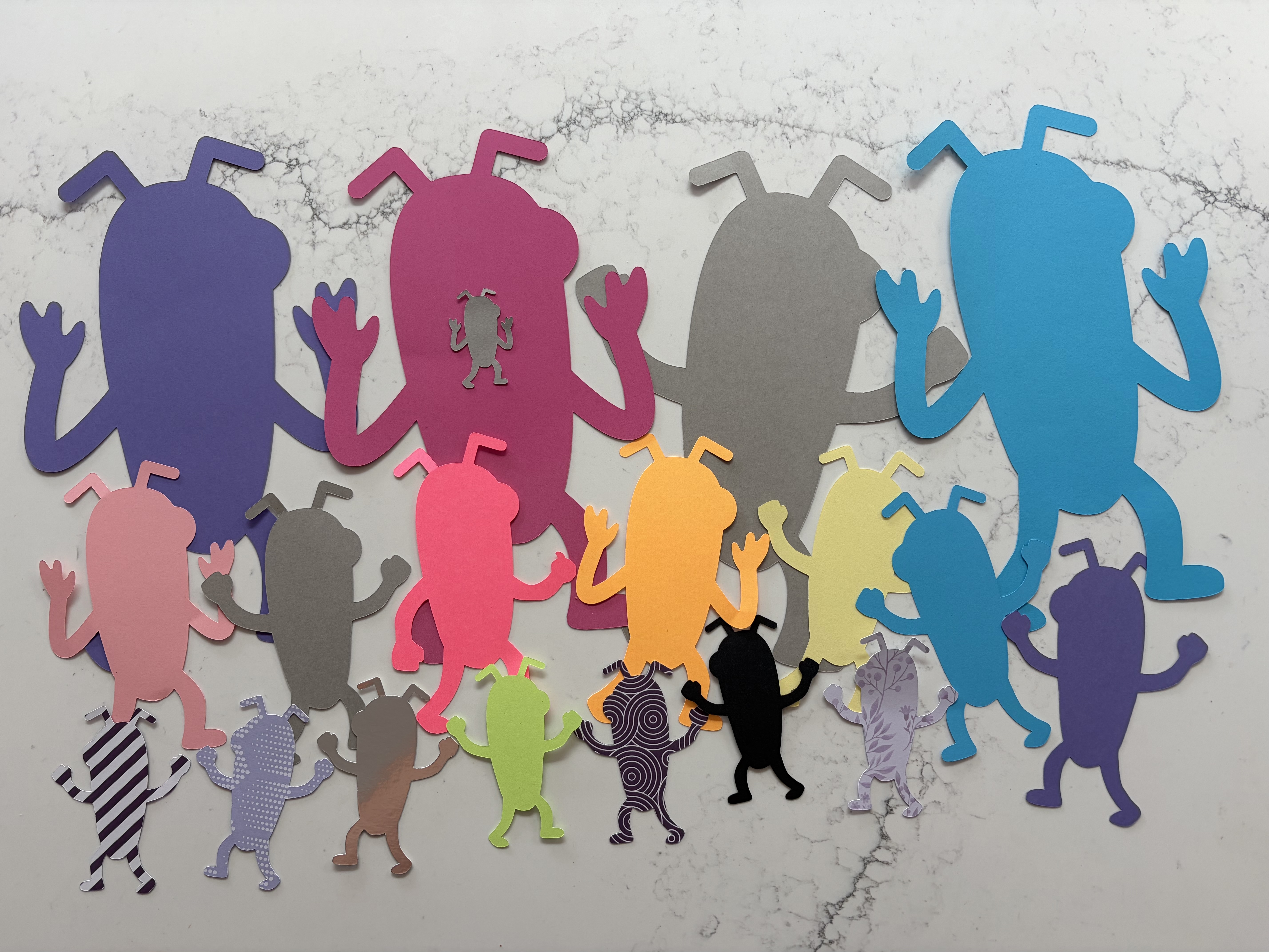 Card cut outs in a variety of colours, sizes and patterns. image
