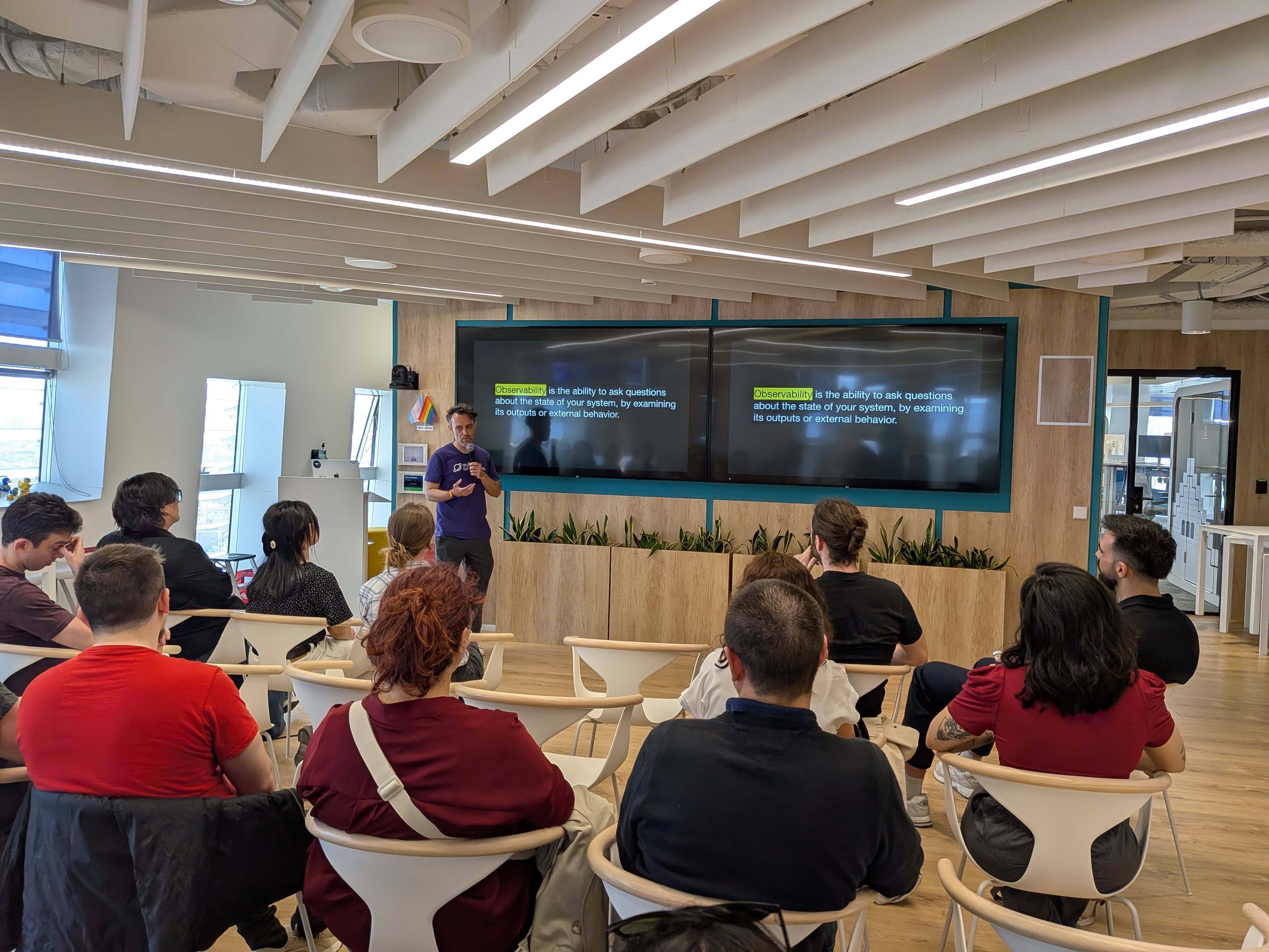 Rodrigo presenting Observability in Testing