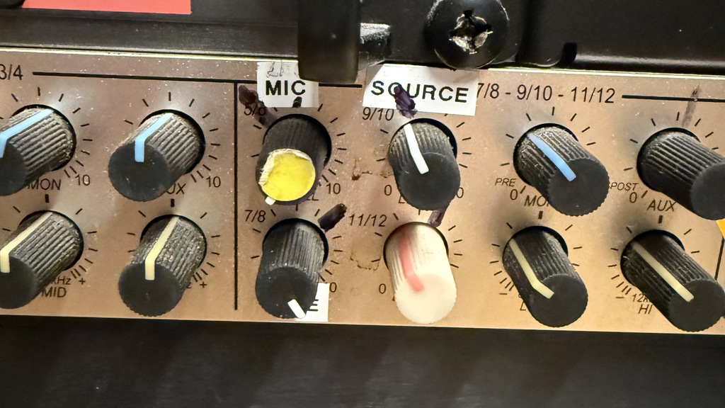 A rack-mounted audio mixer panel positioned below a Sennheiser ew 100 G3 receiver. The mixer features rows of black c... image