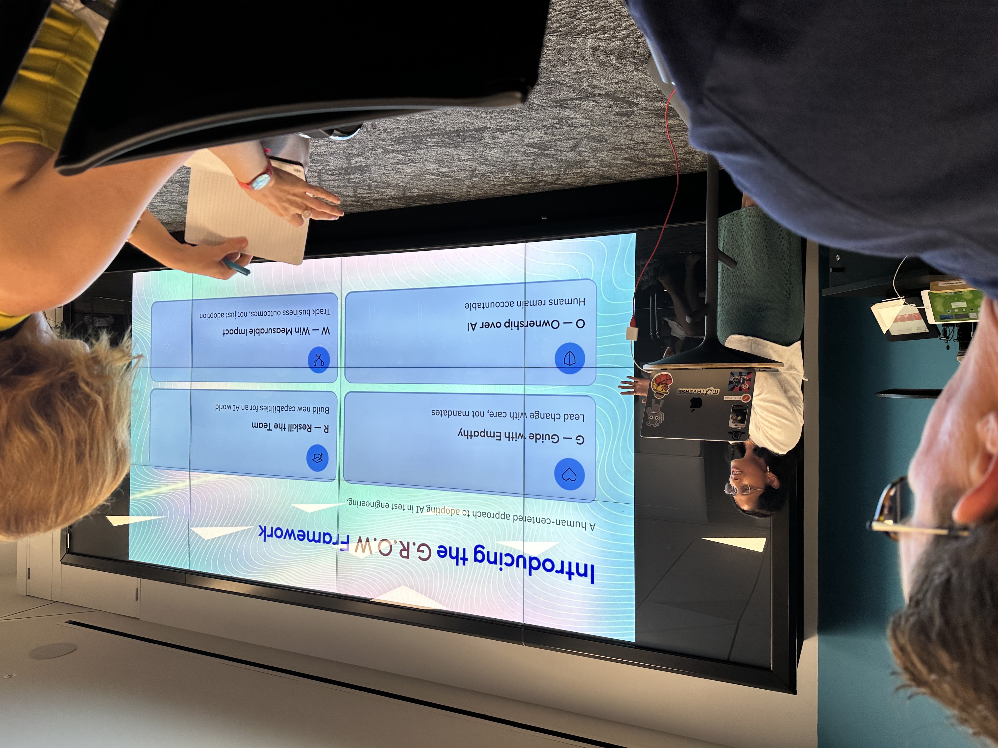 A presenter in front of an audience  image