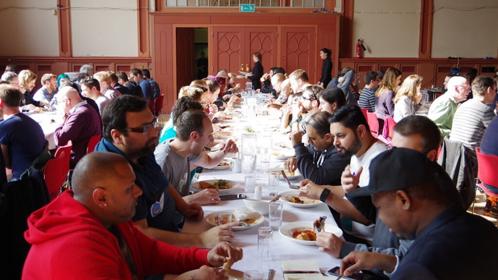 People eating and long food tables at TestBash 2016 image