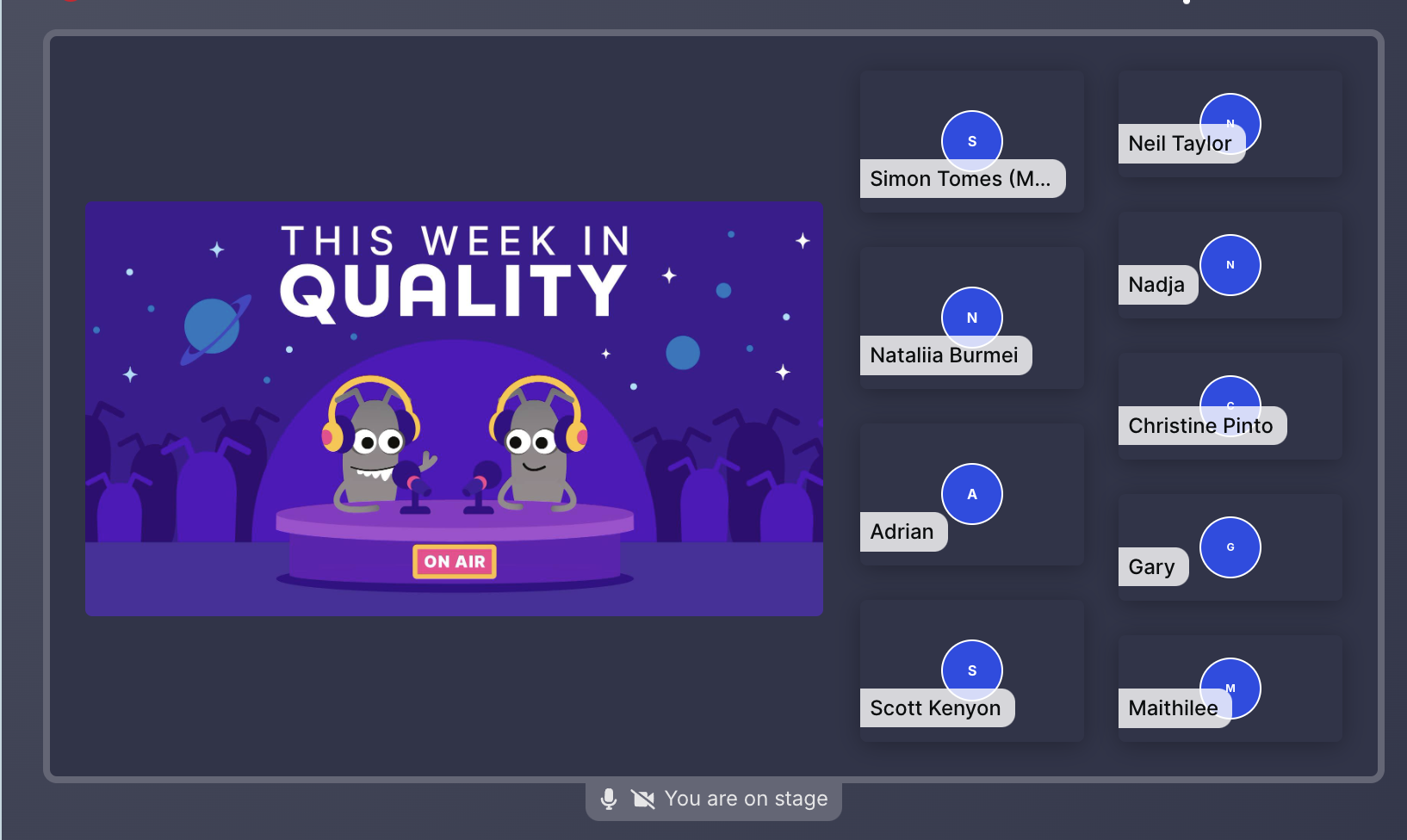 A virtual stage screen for a podcast called "This Week in Quality" features a banner illustration of two cartoon microbes wearing headphones and standing at microphones on a circular purple stage, with planets, stars, and antennae-like figures in the dark purple background. To the right, a list of nine attendees is displayed in dark blue rectangular boxes with their names and initials: Simon Tomes (M...), Neil Taylor, Natalia Burmei, Nadja, Adrian, Christine Pinto, Scott Kenyon, Gary, and Maithilee. The bottom center includes a microphone icon and the text "You are on stage."