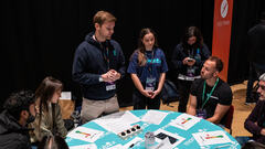 Robbie Falck and Grace Marsey from MoneyBox presenting at MoTaCon image