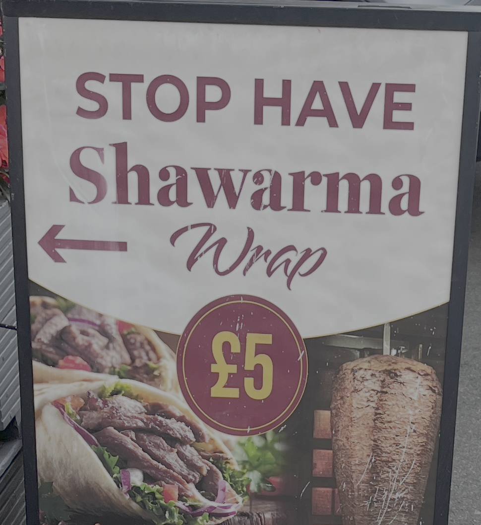 A sign which reads: "STOP HAVE Shawarma wrap £5' image