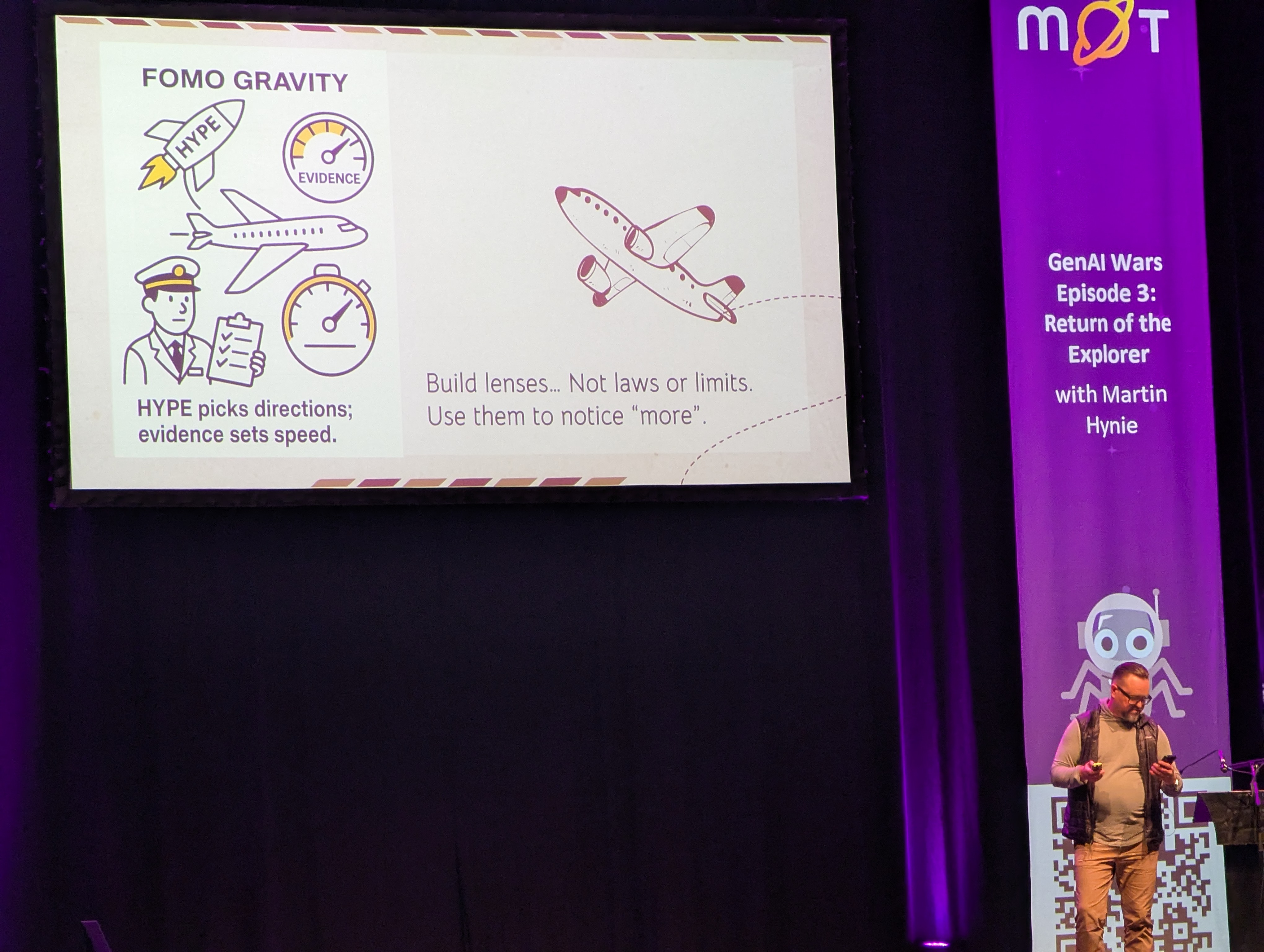 Martin Hynie on stage at test bash 2025 with a slide about FOMO driven ai adoption.