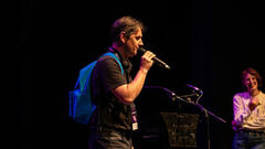 He may or may not have been sharing a joke on 99 second MoTaCon stage. image