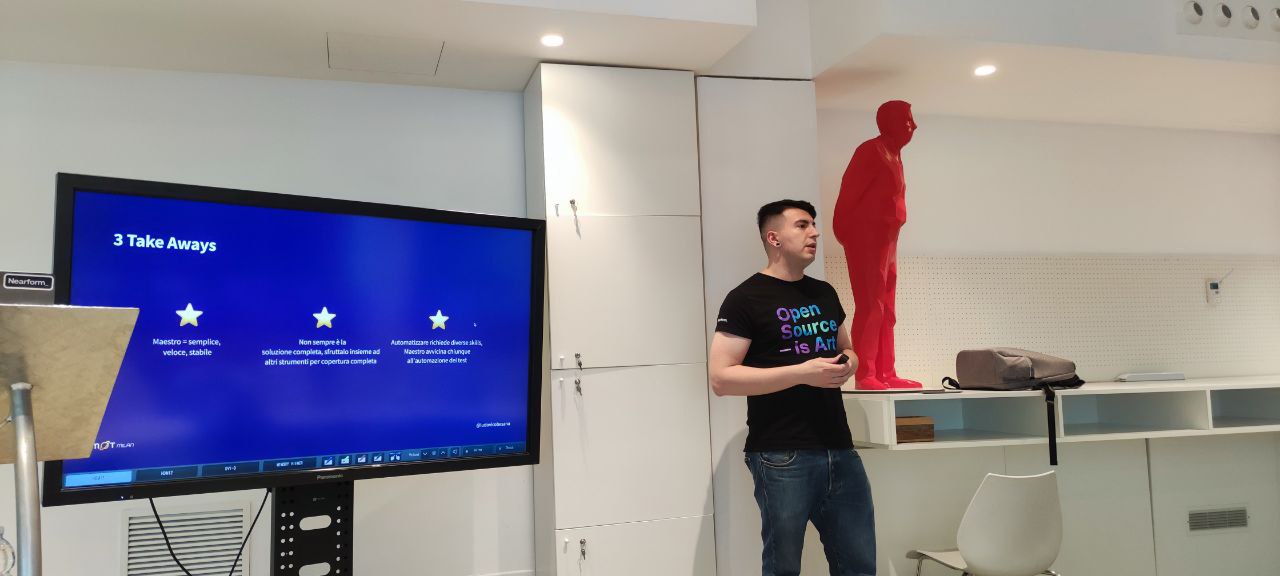 A small crowd gathered at a cozy meetup space in Milan, watching a live demo on mobile test automation. Smiles, laptops, and snacks. The first Ministry of Testing Milan event in full swing.