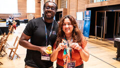 Eamon Droko and Ayesha Saeed showing off their swag! Postman duck and Bug Mug! image