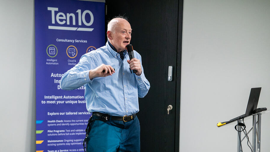 Andrew Brown on stage at MoT London image