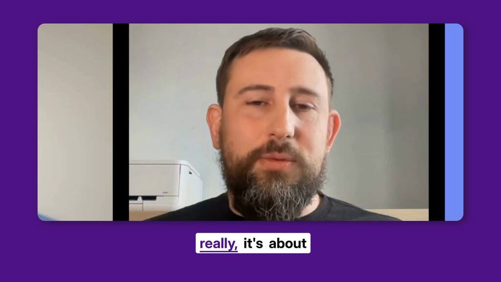 A man speaking direct to camera. image