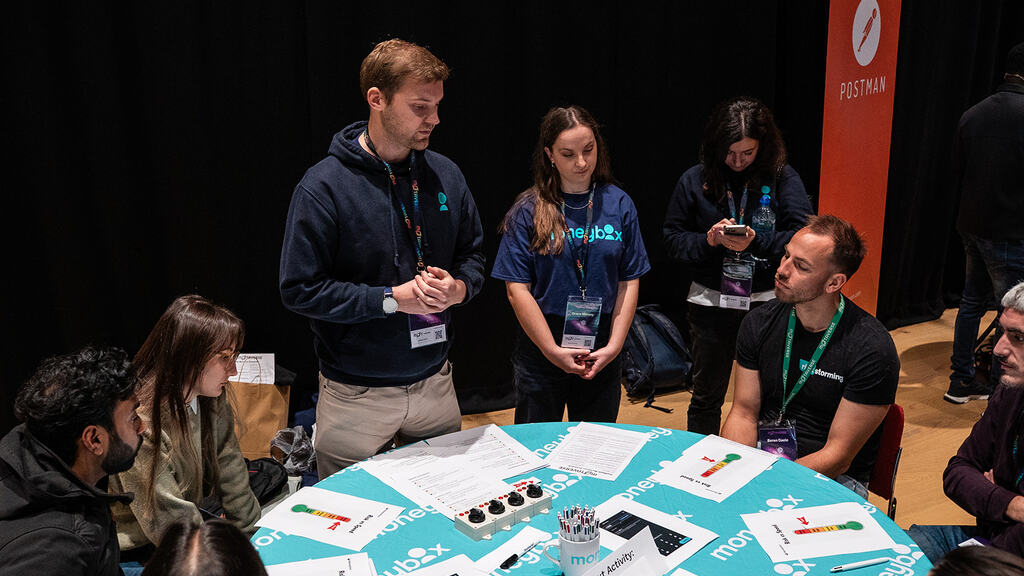 Robbie Falck and Grace Marsey from MoneyBox presenting at MoTaCon image