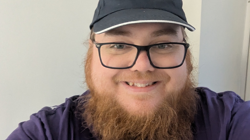 Ben in MoTaverse cap and purple test bash t-shirt  image