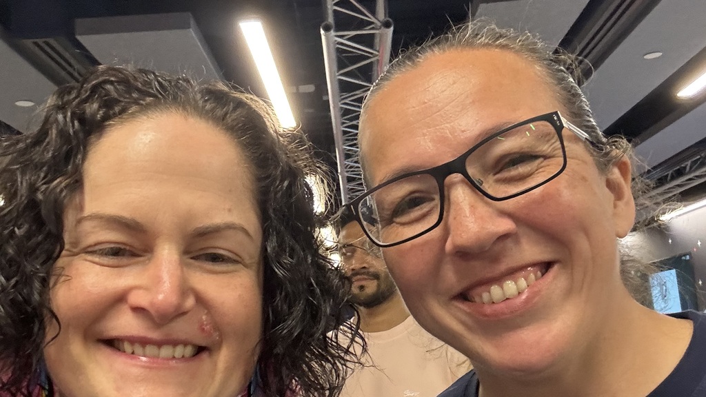 Two people posing for a selfie after meeting for the first time.