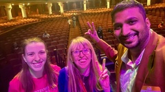 Myself, Melissa Fisher and Rahul Parwal take a selfie infront of a mostly empty auditorium image