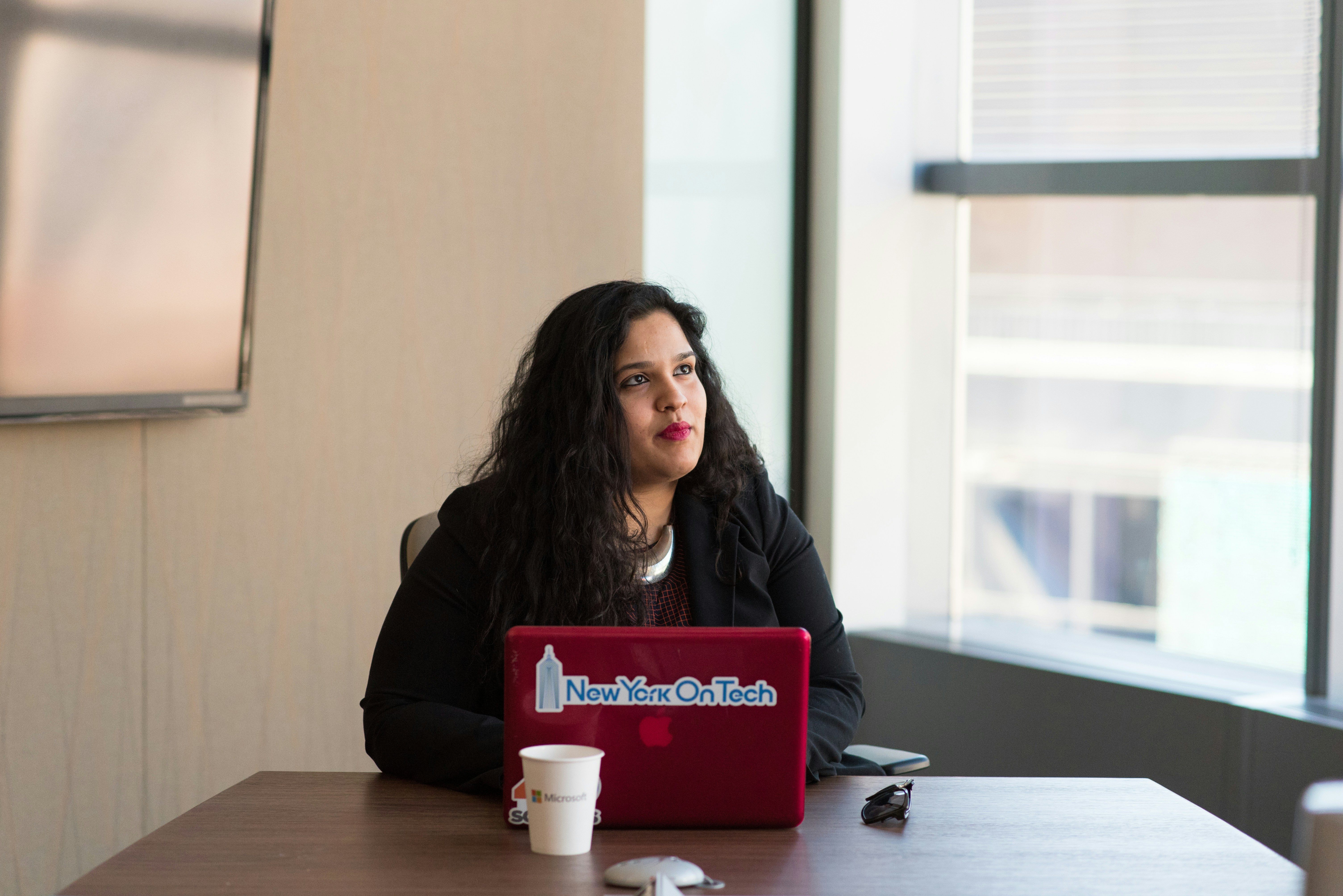 An IT woman pondering in front of a laptop.
From the women of color in tech picture collection on Unsplash. image
