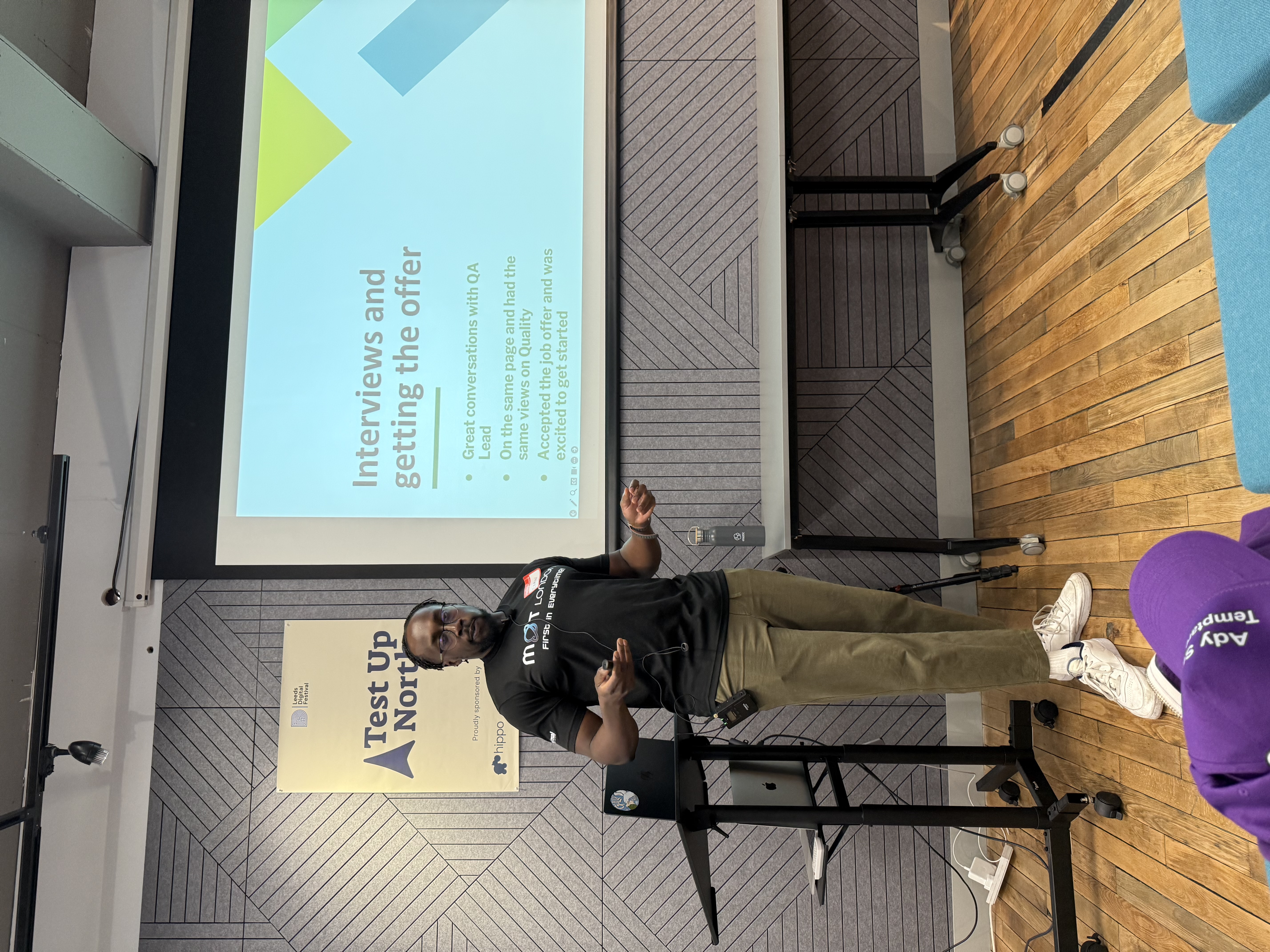 Eamon wearing an MoT black London tshirt presenting with a slide showing interviews and getting the offer. After great conversation he was eager to get started. But the interviewer left before he started! 