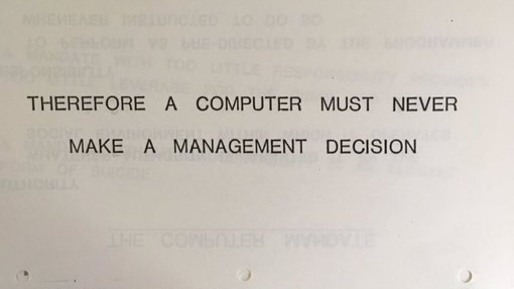 Text stating " a computer can never be held accountable. Therefore a computer must never make a management decision." image