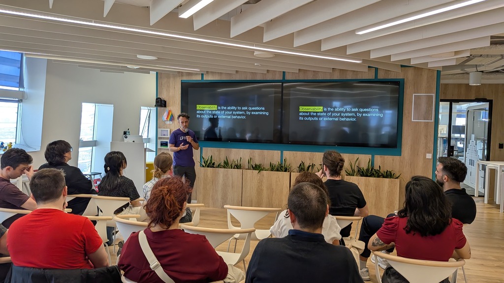 Rodrigo presenting Observability in Testing