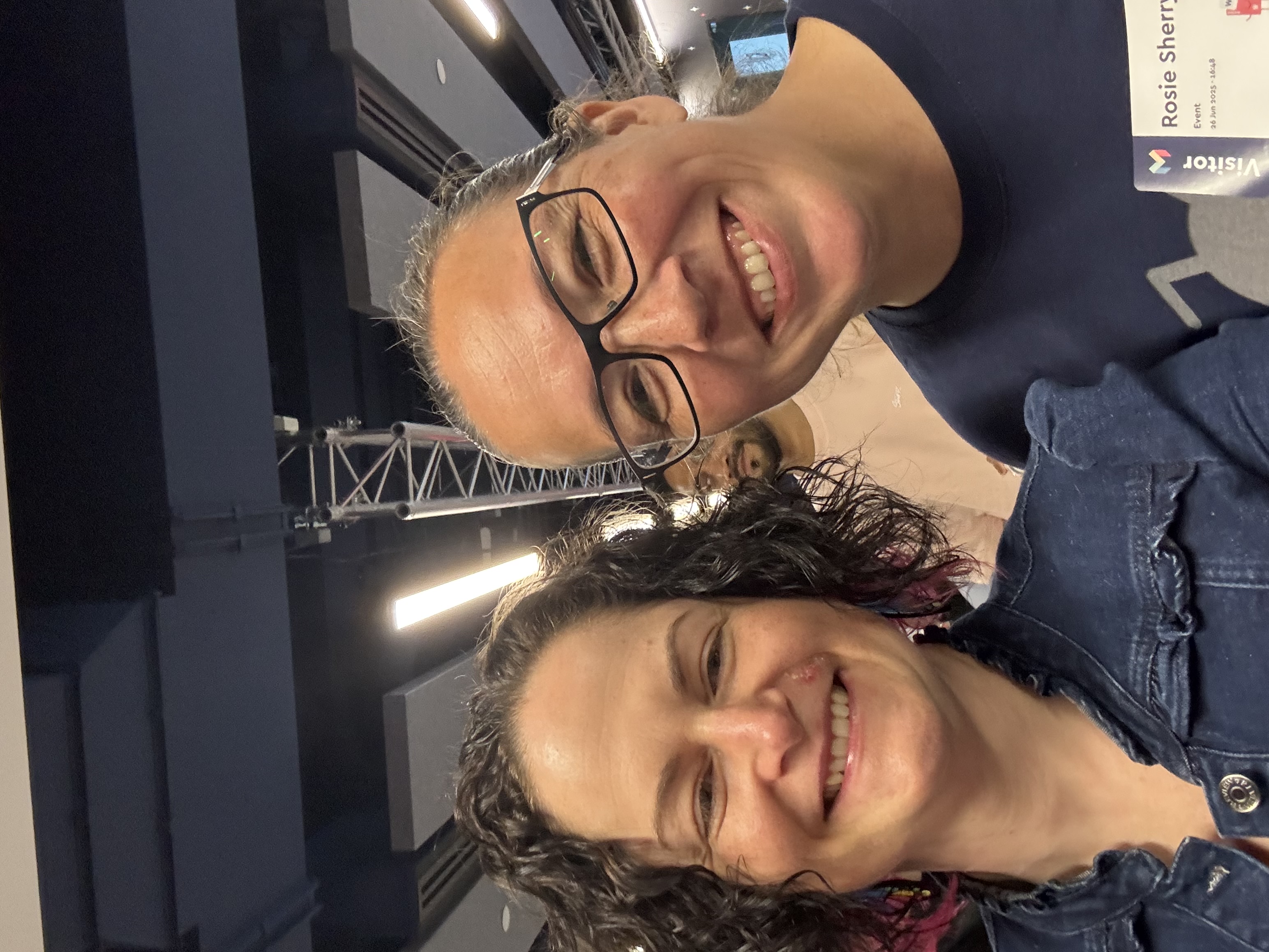 Two people posing for a selfie after meeting for the first time.