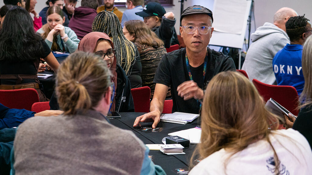 People gathered around a Riskstorming and AI session