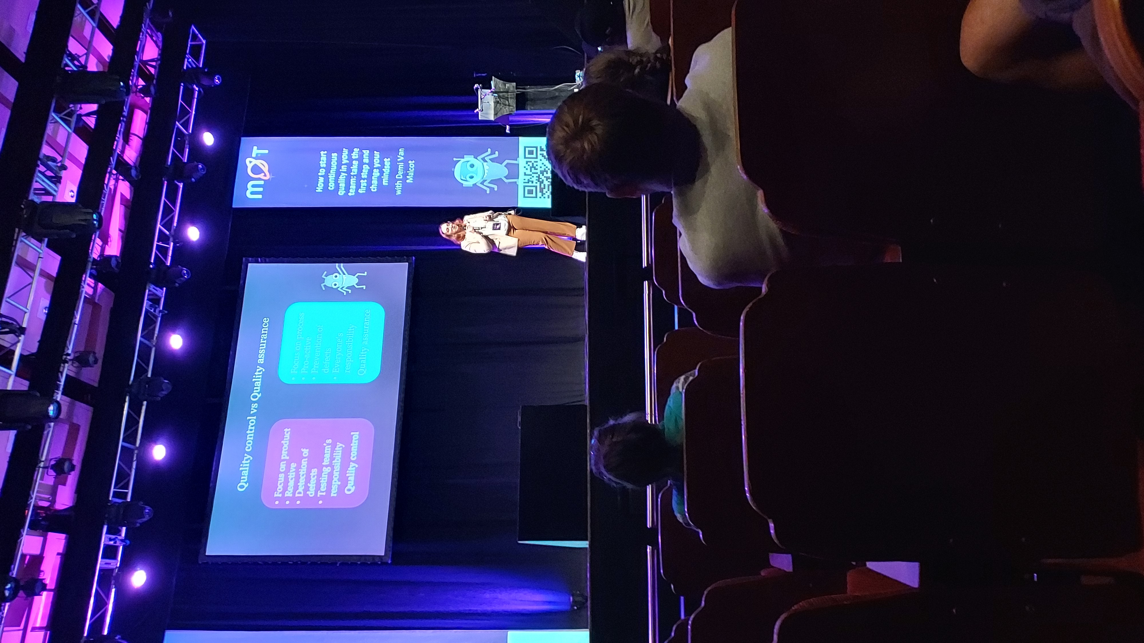 Demi Van Malcot giving her talk on starting with continuous quality.